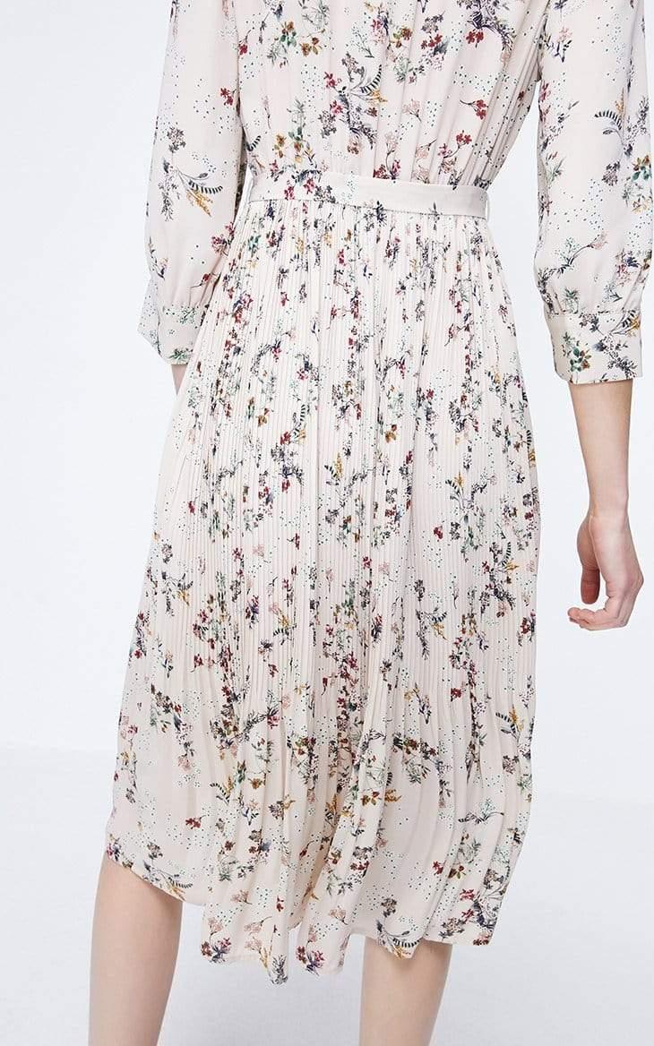 Floral dress with long sleeves on a white background