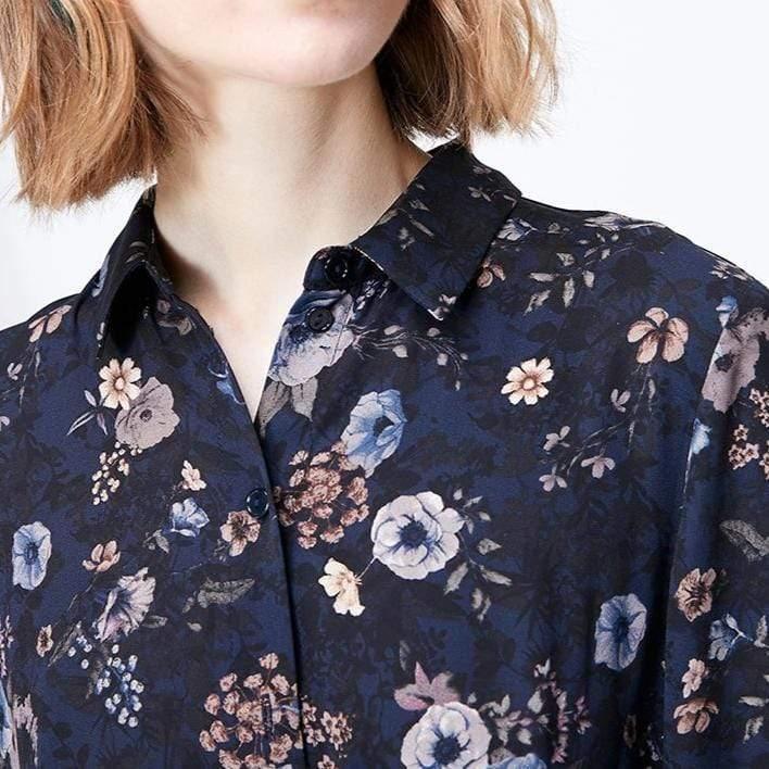 Navy floral patterned shirt worn by a person
