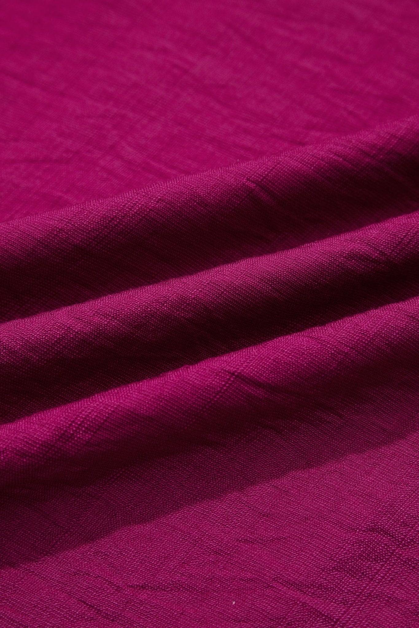 Close-up of purple fabric with a textured pattern