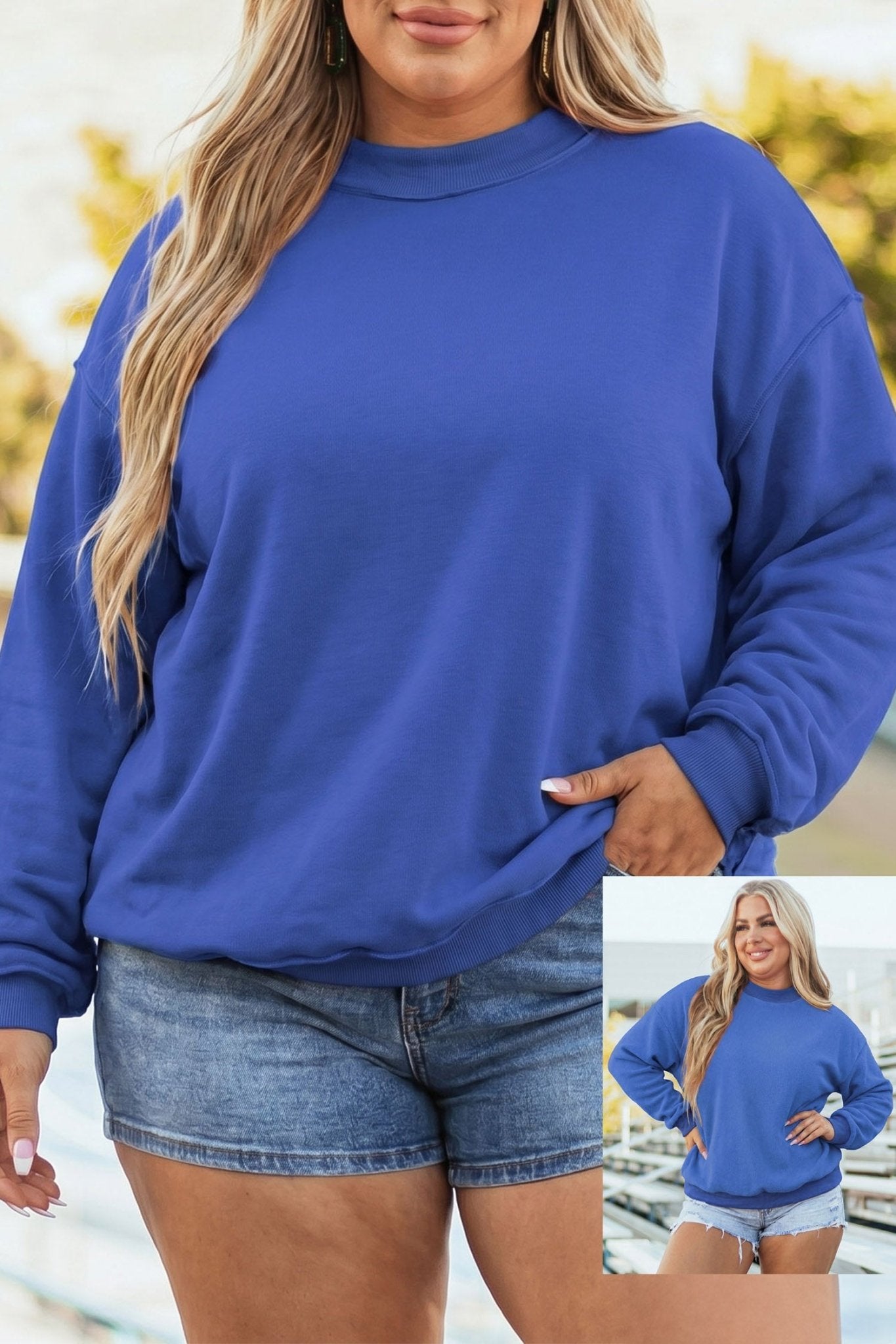 Woman wearing royal blue crewneck sweatshirt and denim shorts with full-outfit inset outdoors.