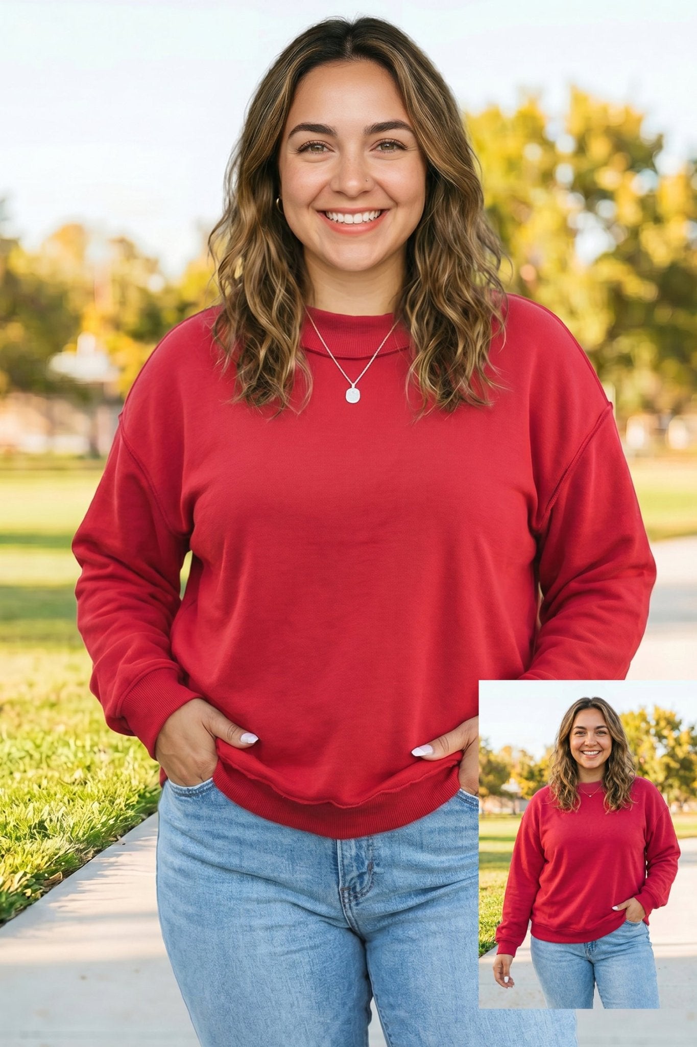 Woman wearing red crewneck sweatshirt and light blue jeans outdoors on a tree-lined path, with inset image.