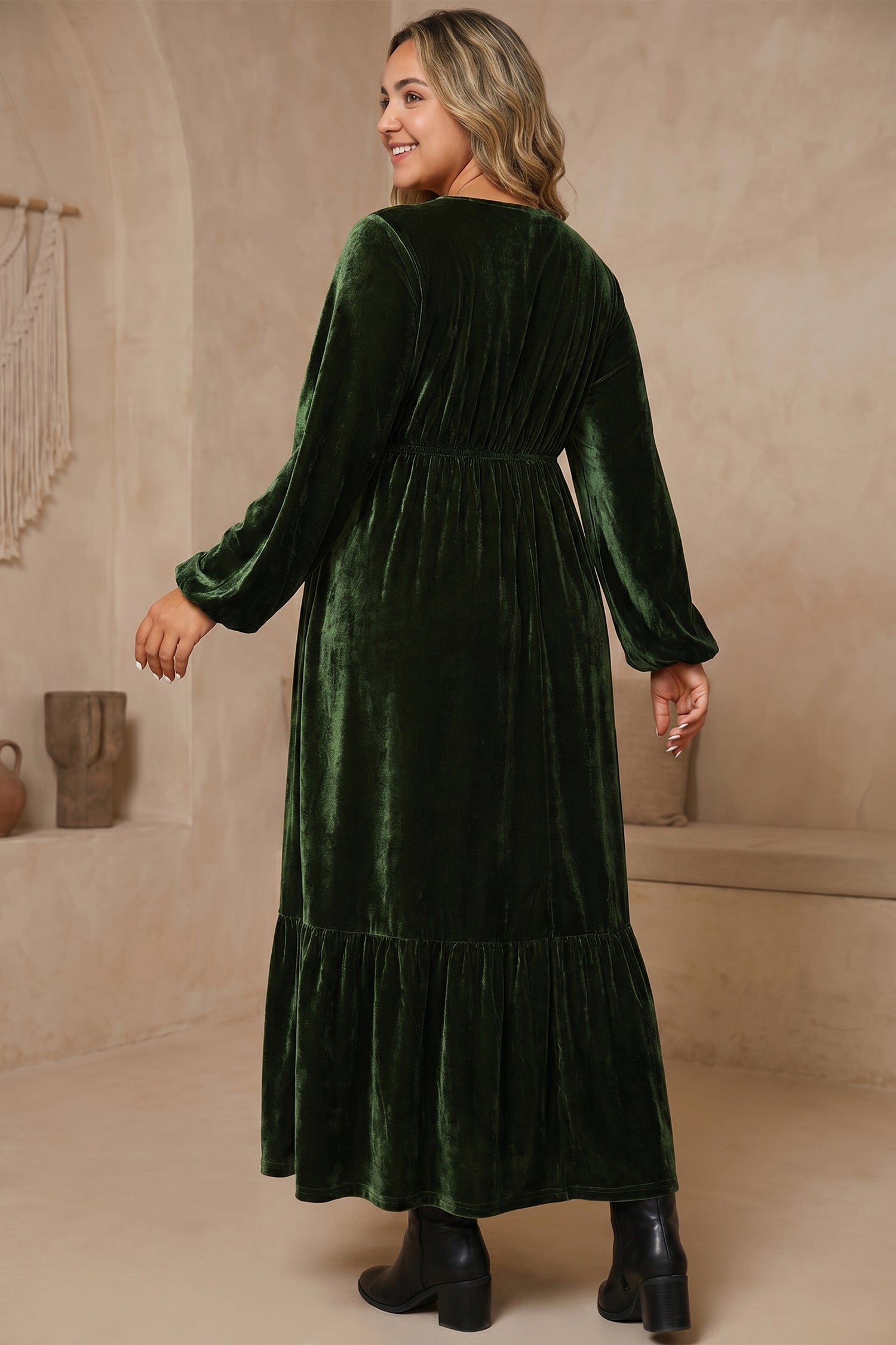 Back view of plus size green velvet long sleeve maxi dress with tiered ruffle hem