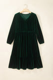 Green velvet V neck tiered maxi dress with long sleeves on a hanger, front view