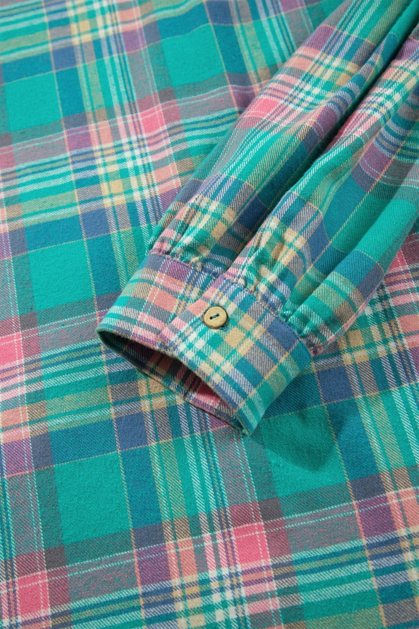 Plaid long-sleeve shirt with folded cuff and button in teal, pink, purple, and yellow.