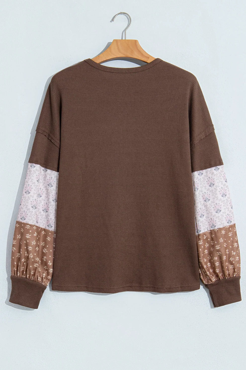 Coffee waffle knit top with cream and brown floral patchwork sleeves, back view