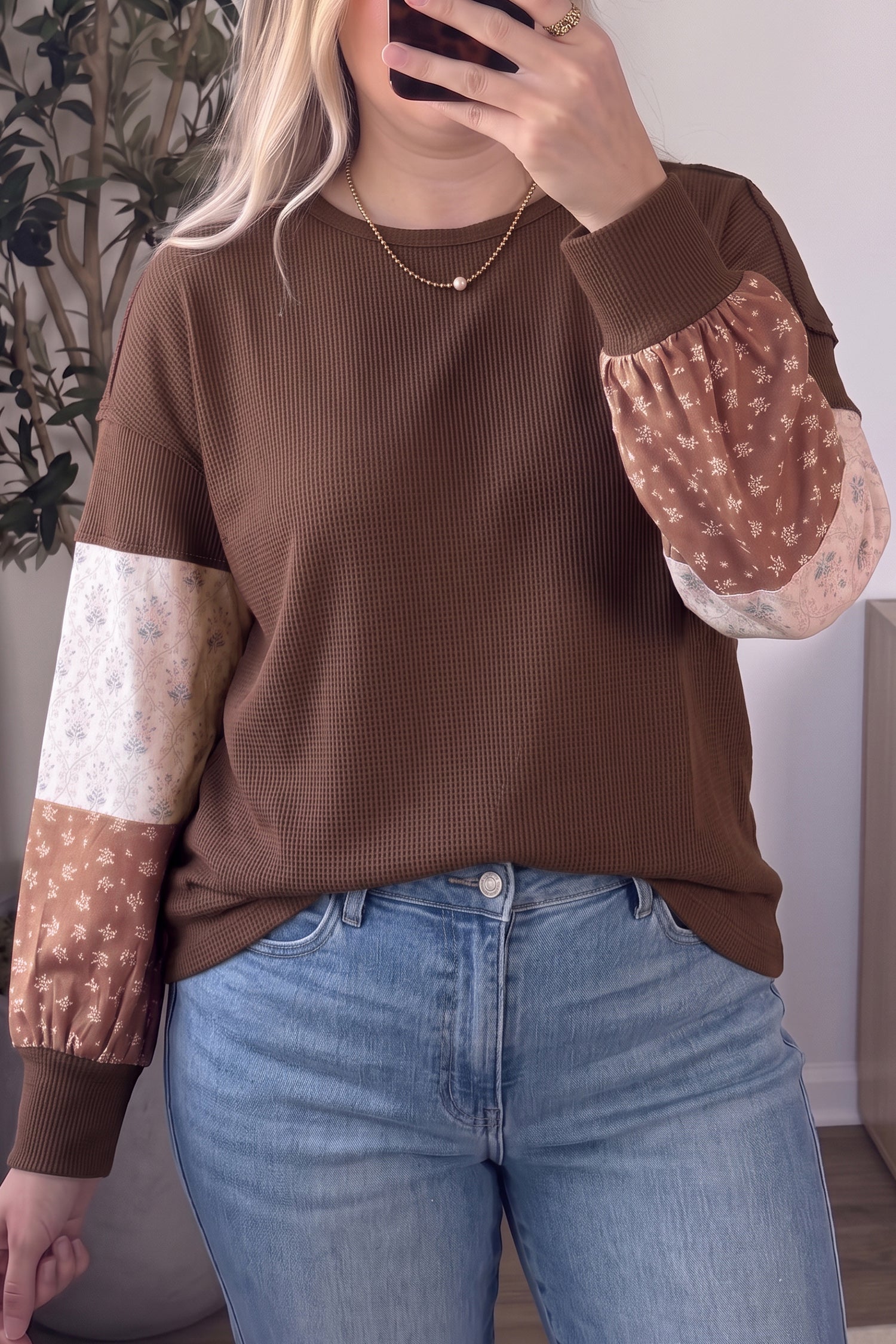 Plus size coffee waffle knit top with floral patchwork balloon sleeves and jeans, front view