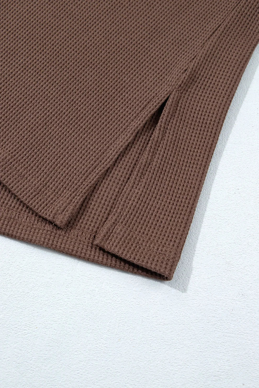 Coffee waffle knit top side slit hem detail