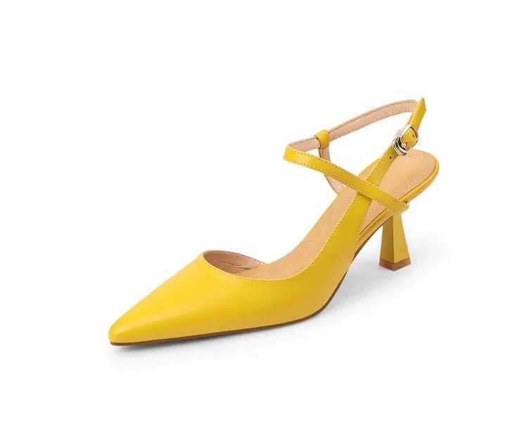 Yellow high-heeled shoe on a white background