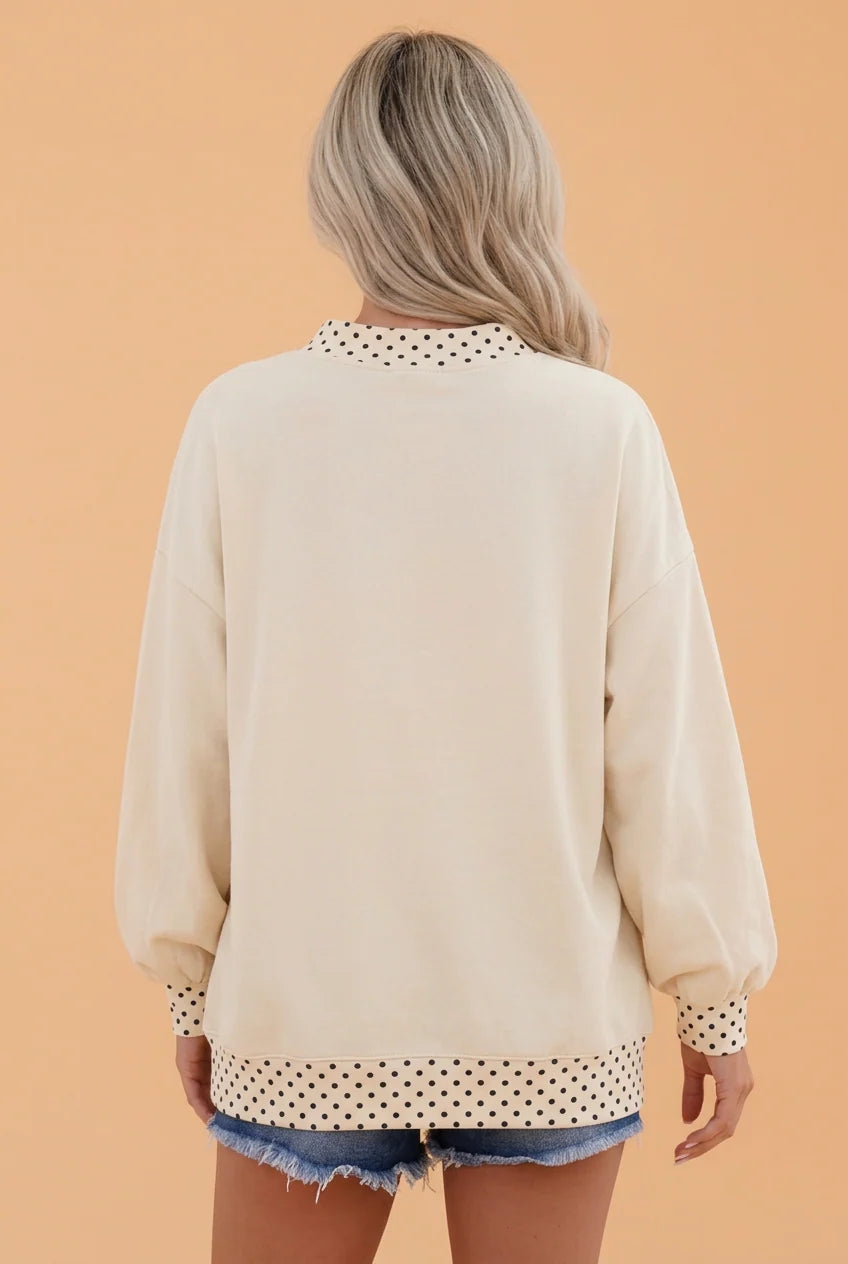 Cream oversized sweatshirt with polka dot collar, cuffs and hem band, back view