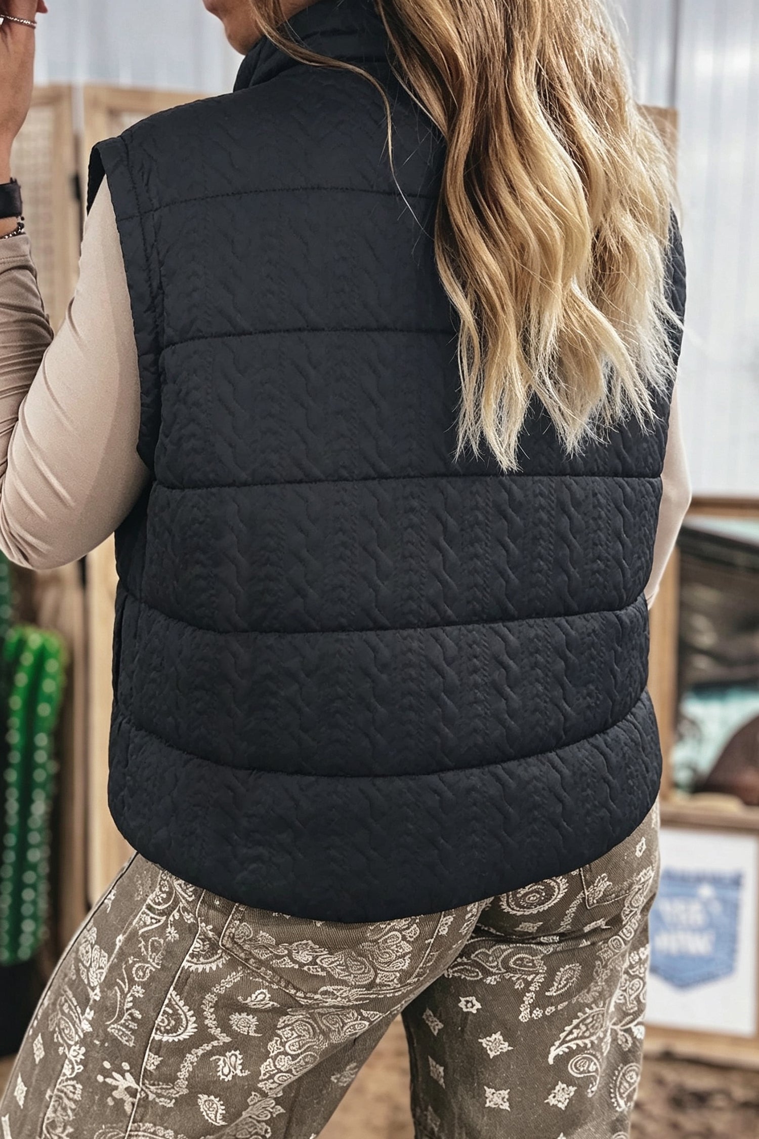 Black cable textured quilted puffer vest, back view
