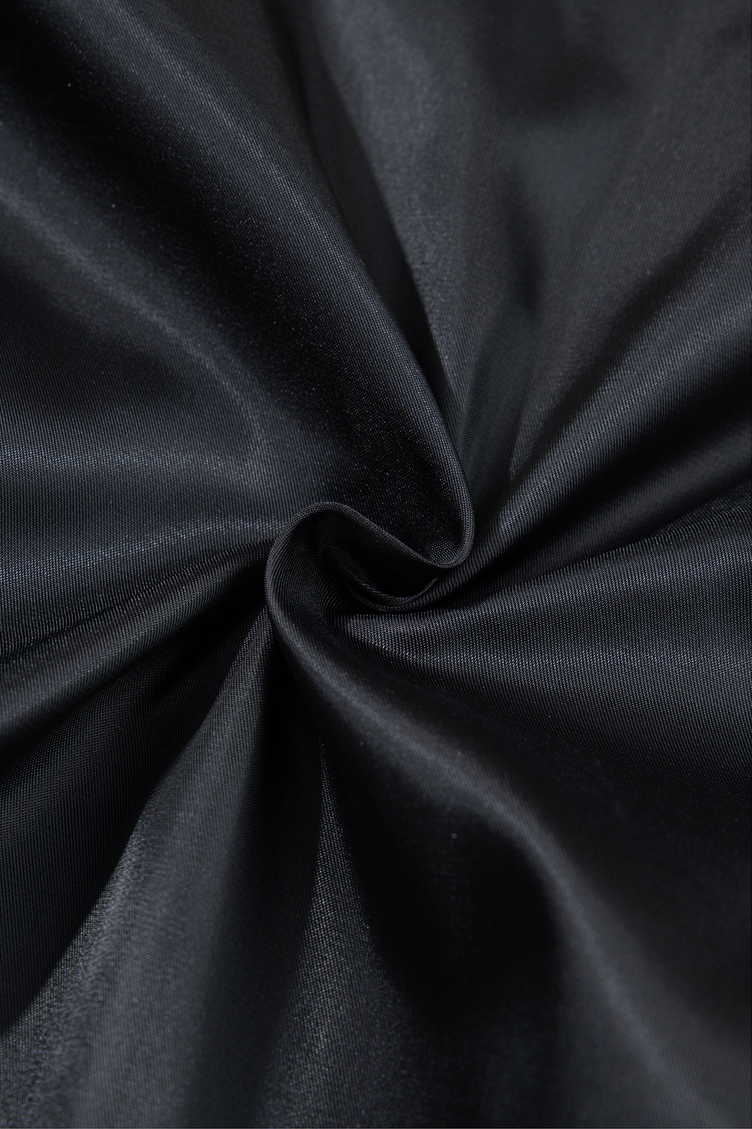 Smooth black inner lining of the quilted puffer vest