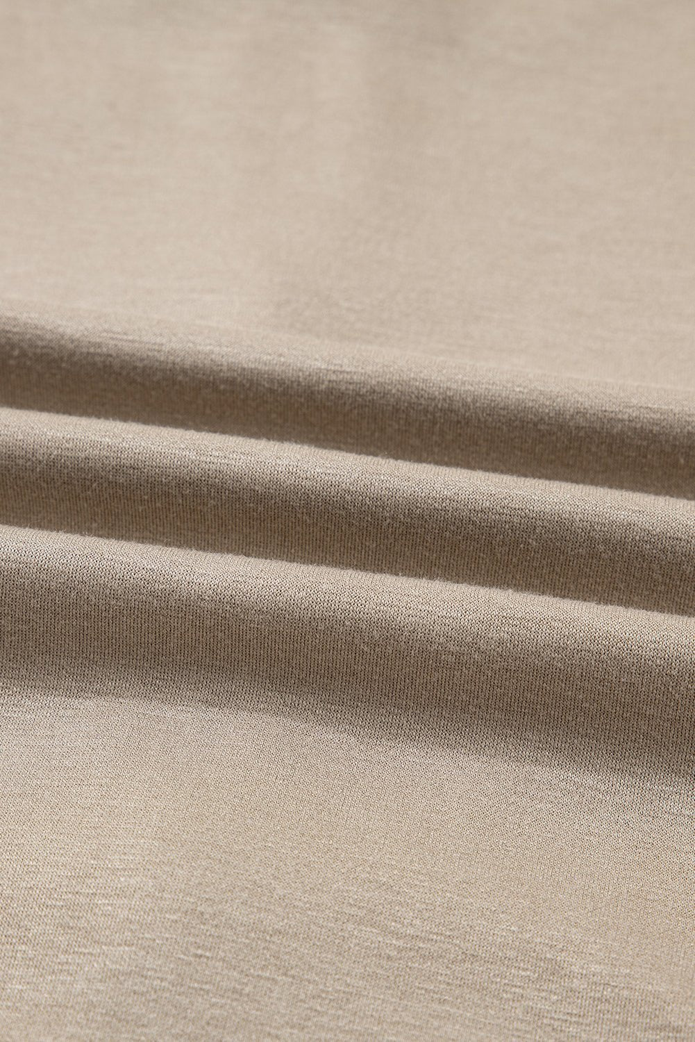 Close-up of beige fabric with visible texture