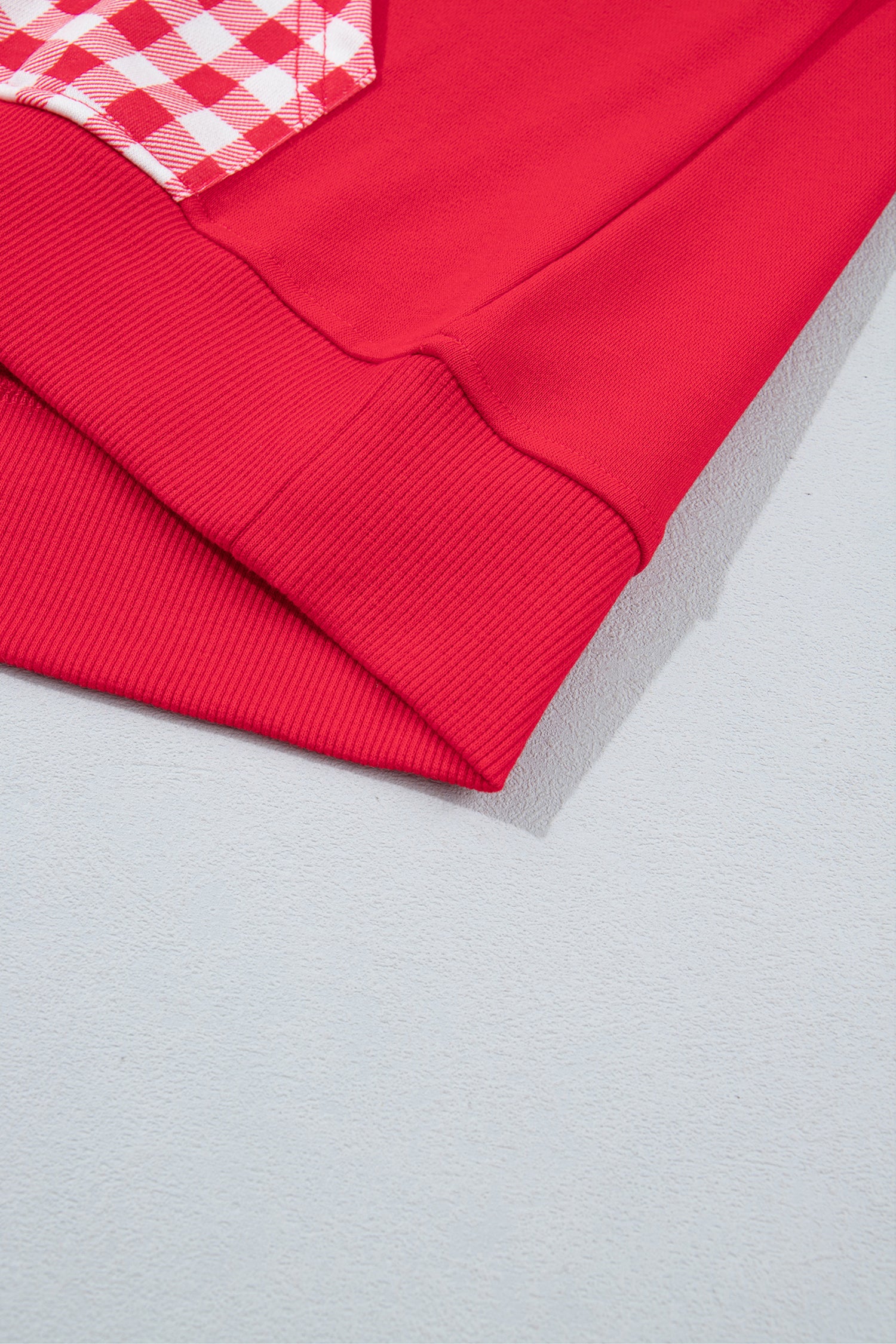 Racing red sweatshirt ribbed hem detail