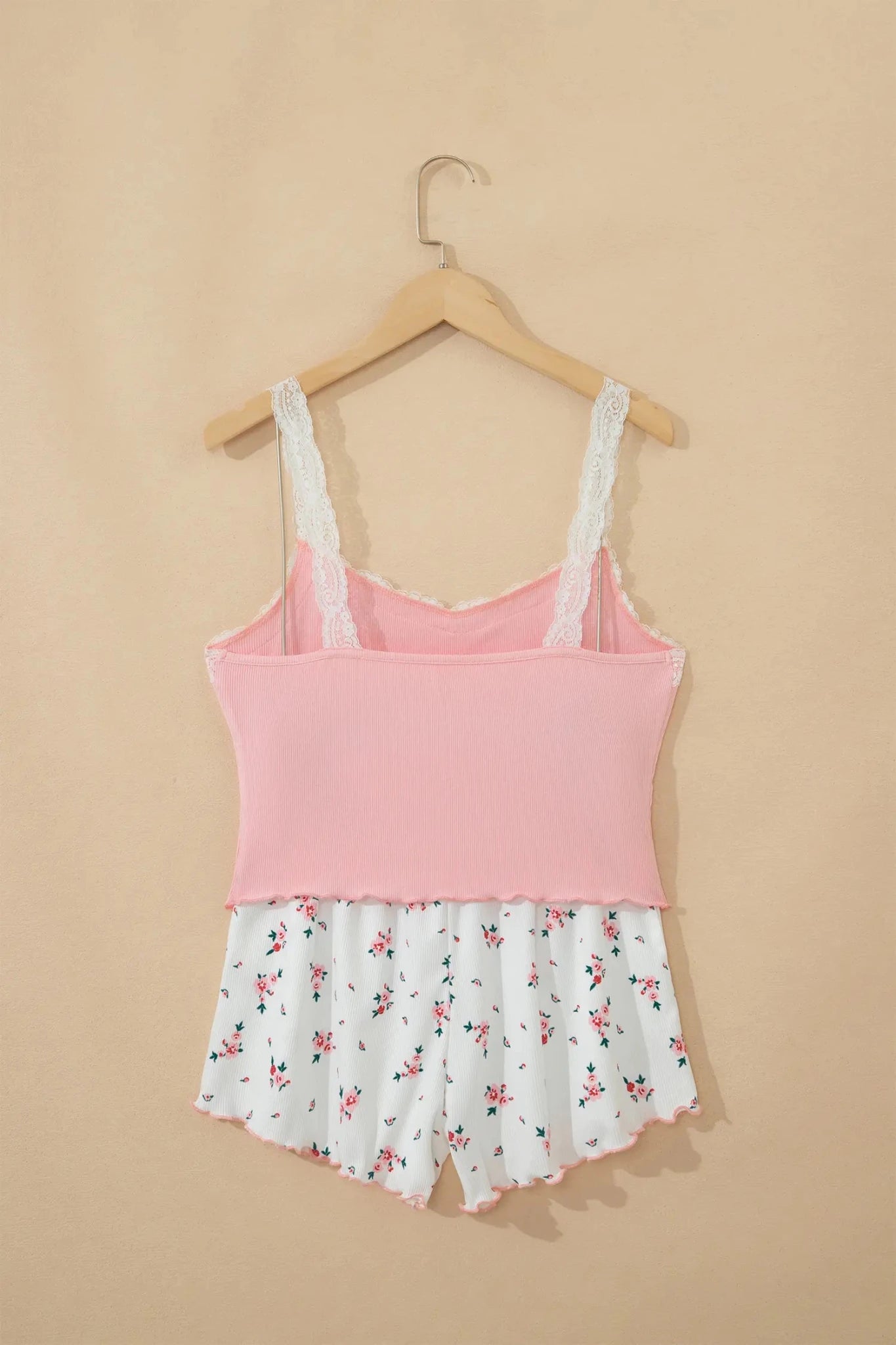 Pink ribbed babydoll set with lace camisole and floral shorts.