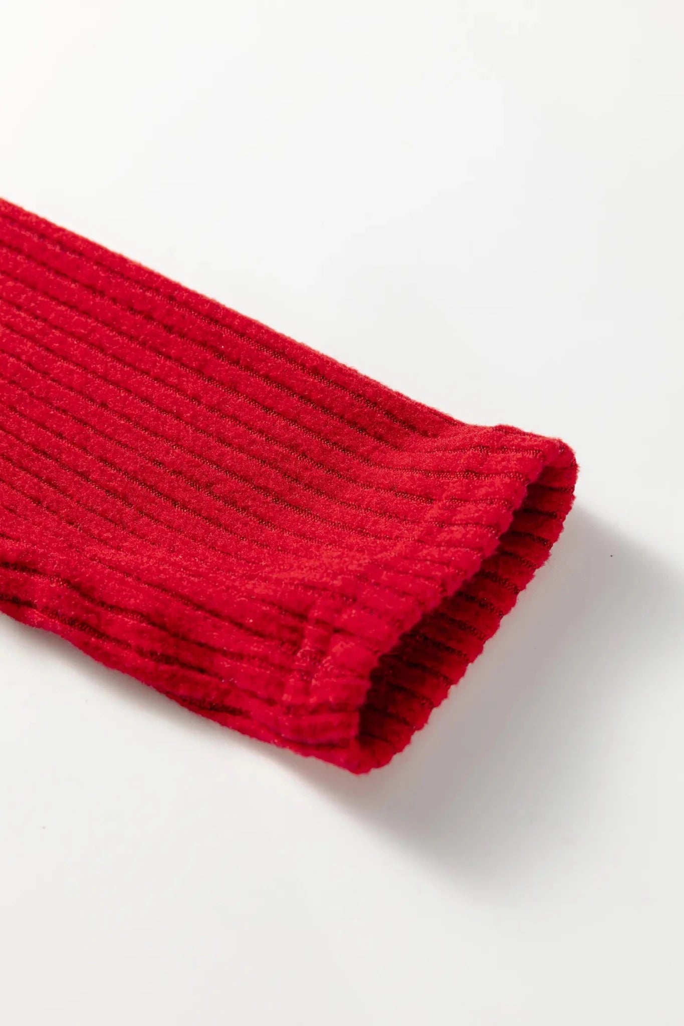 Red knitted fabric on a white background
