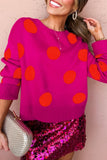 Woman in pink polka-dot sweater & sequined skirt with clutch.