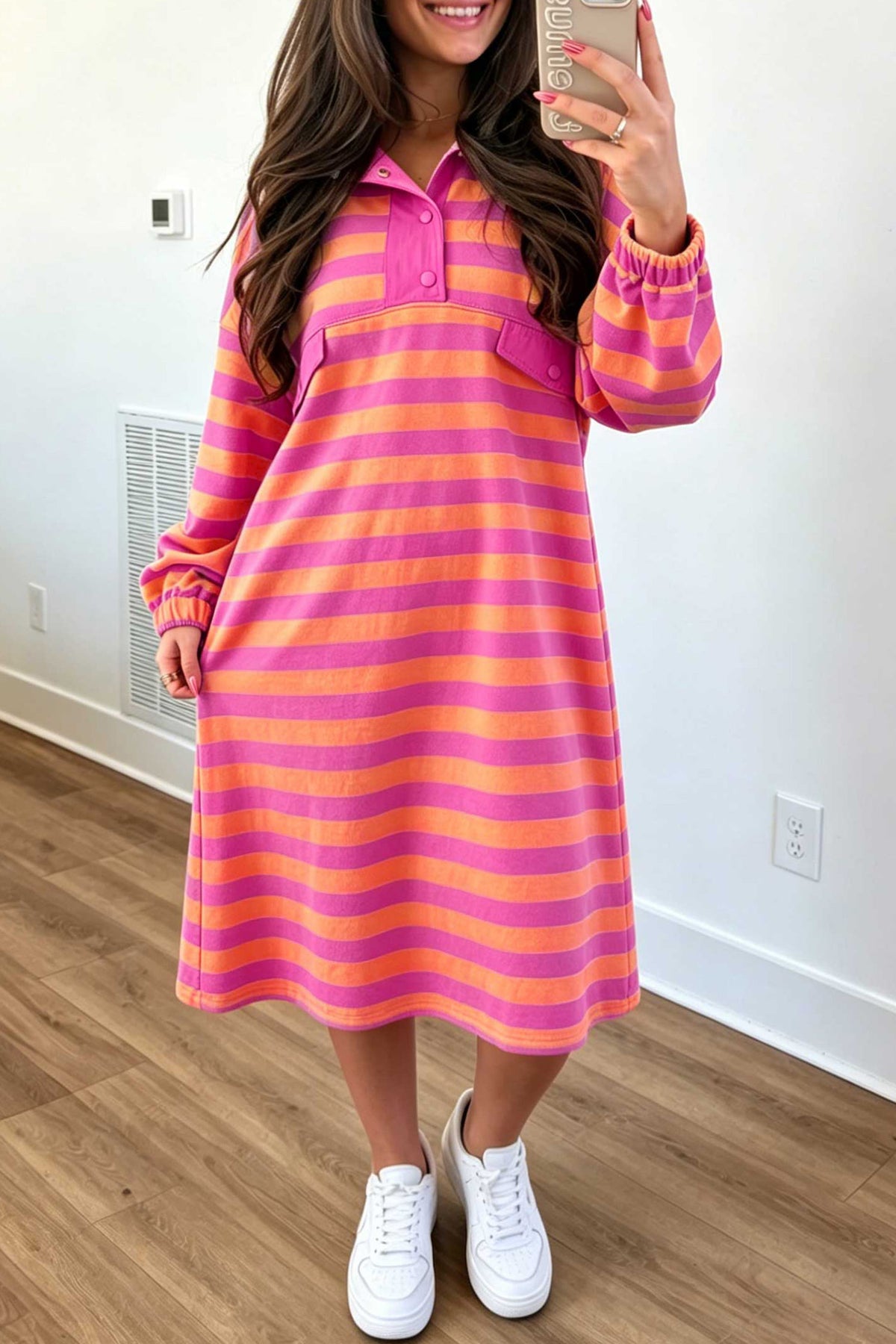 Woman in rose and orange stripe polo collar long sleeve midi dress with white sneakers