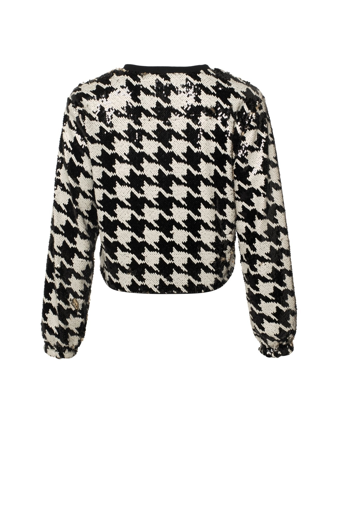 Black and white houndstooth patterned sweater on a white background
