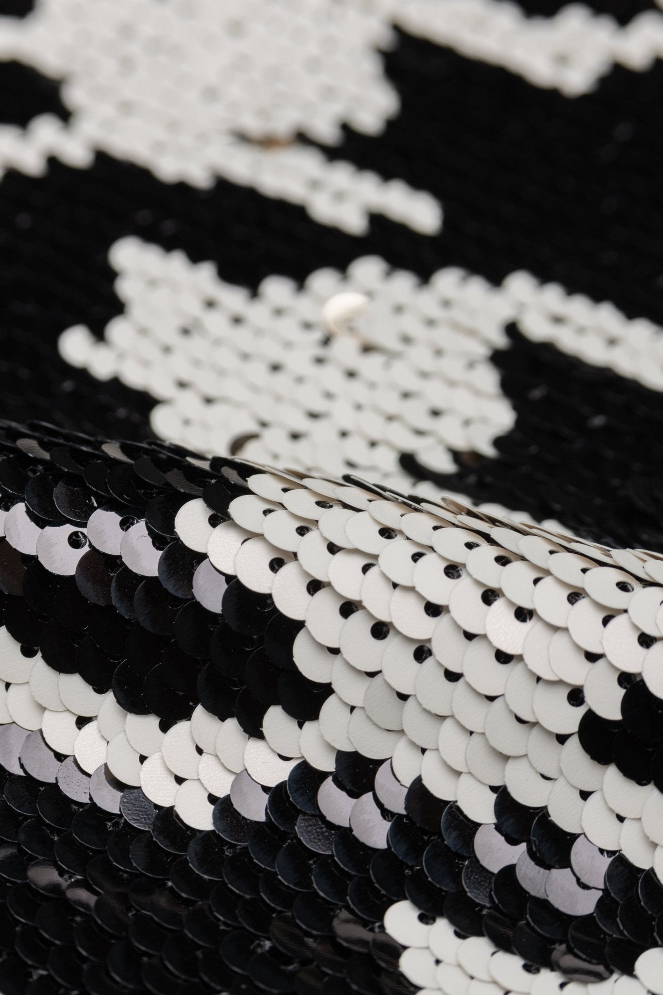 Close-up of black and white sequin fabric