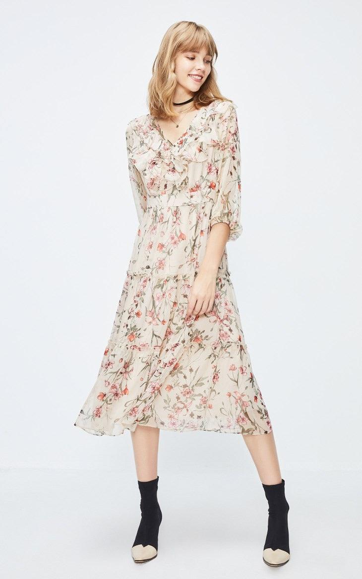 Woman wearing a floral dress on a white background