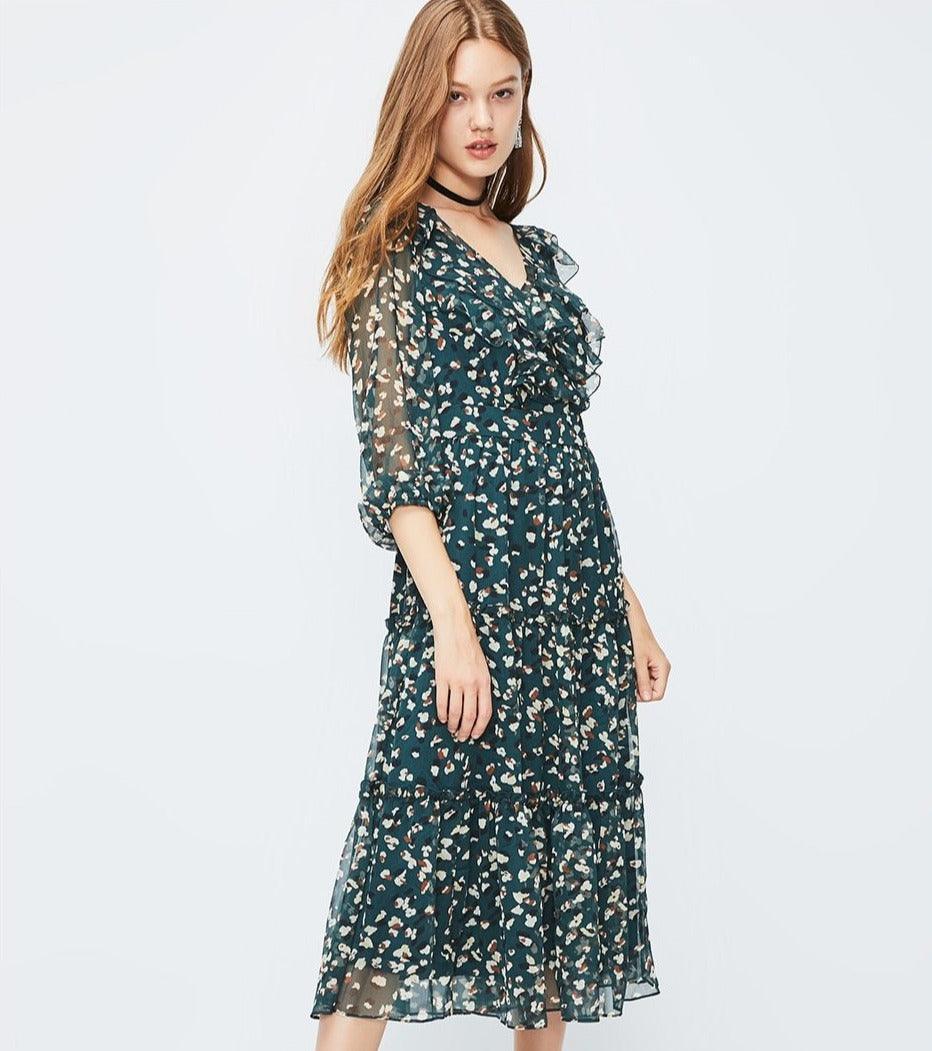 Woman wearing a floral dress on a white background