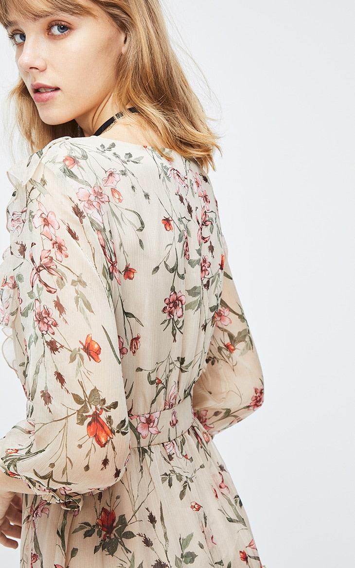 Woman wearing a floral dress on a white background