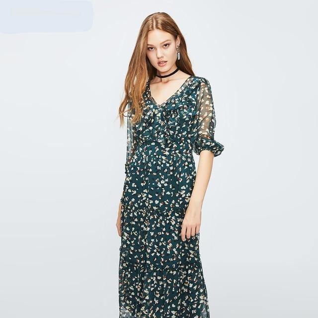 Woman wearing a floral dress on a white background