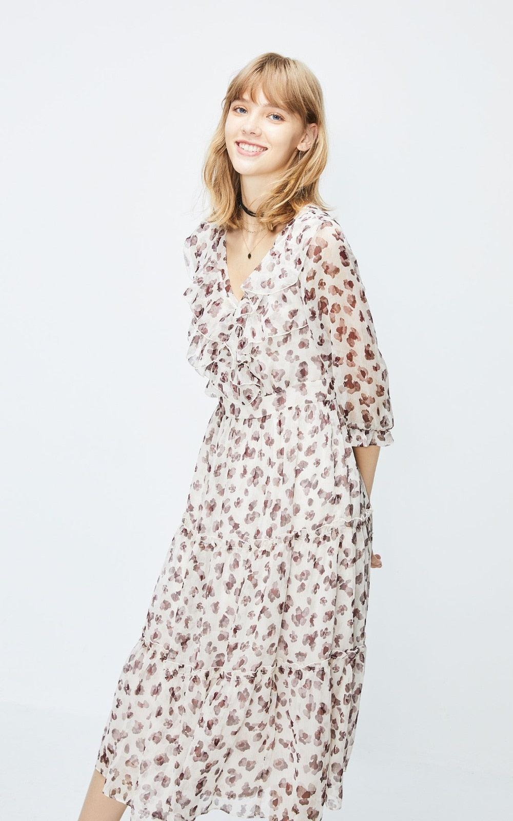Woman wearing a floral dress on a white background