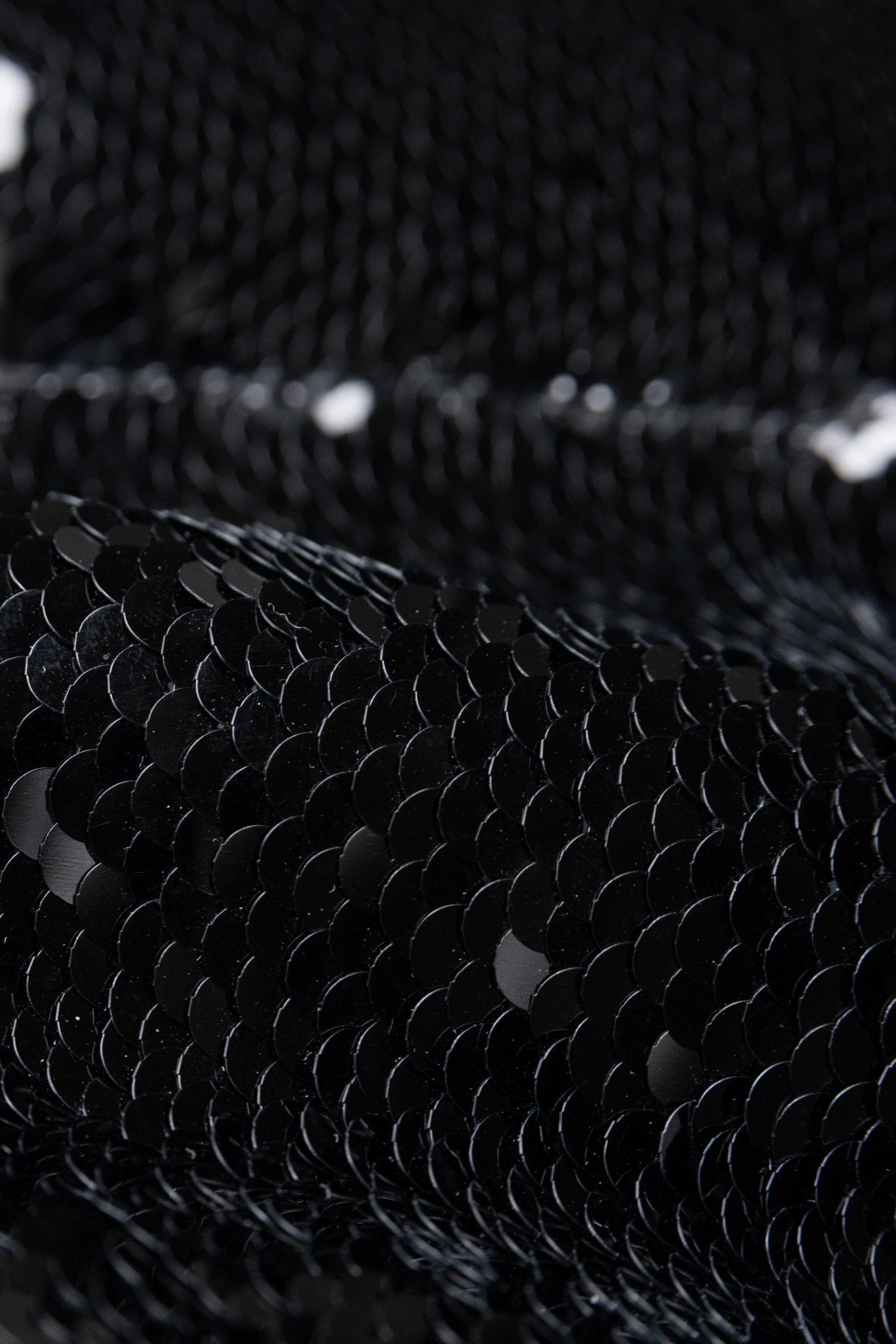 Close-up of black sequin fabric