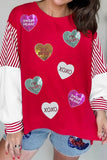 Red shirt with heart-shaped designs and text worn by a person