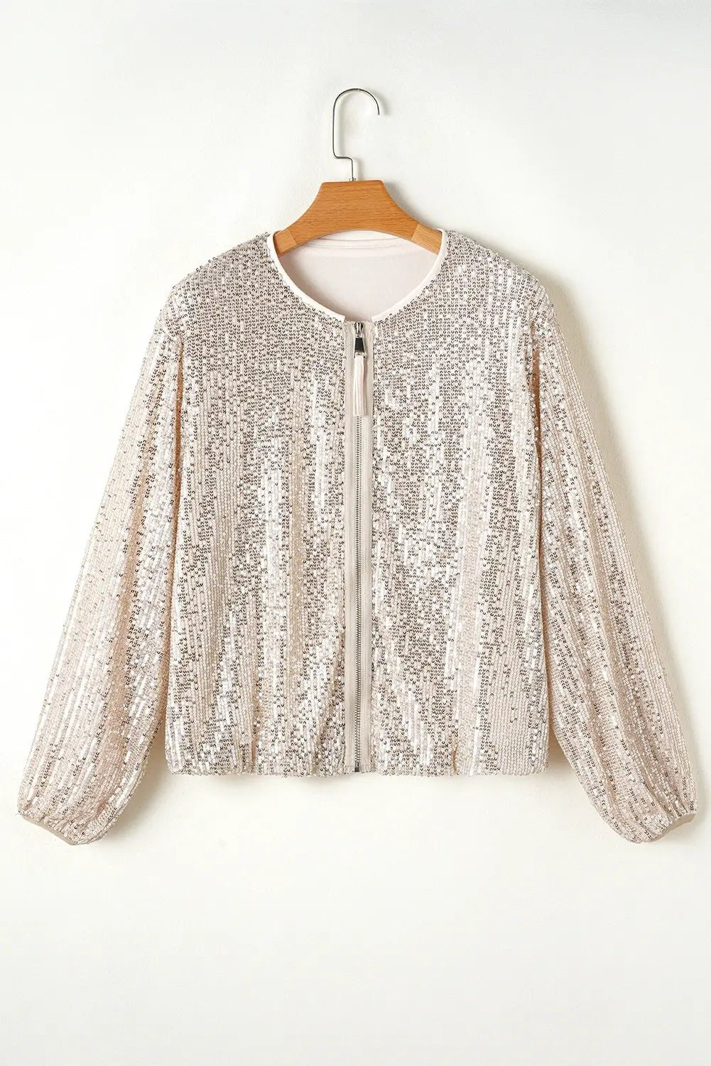 Champagne sequin long-sleeve zip-up jacket on a wooden hanger.