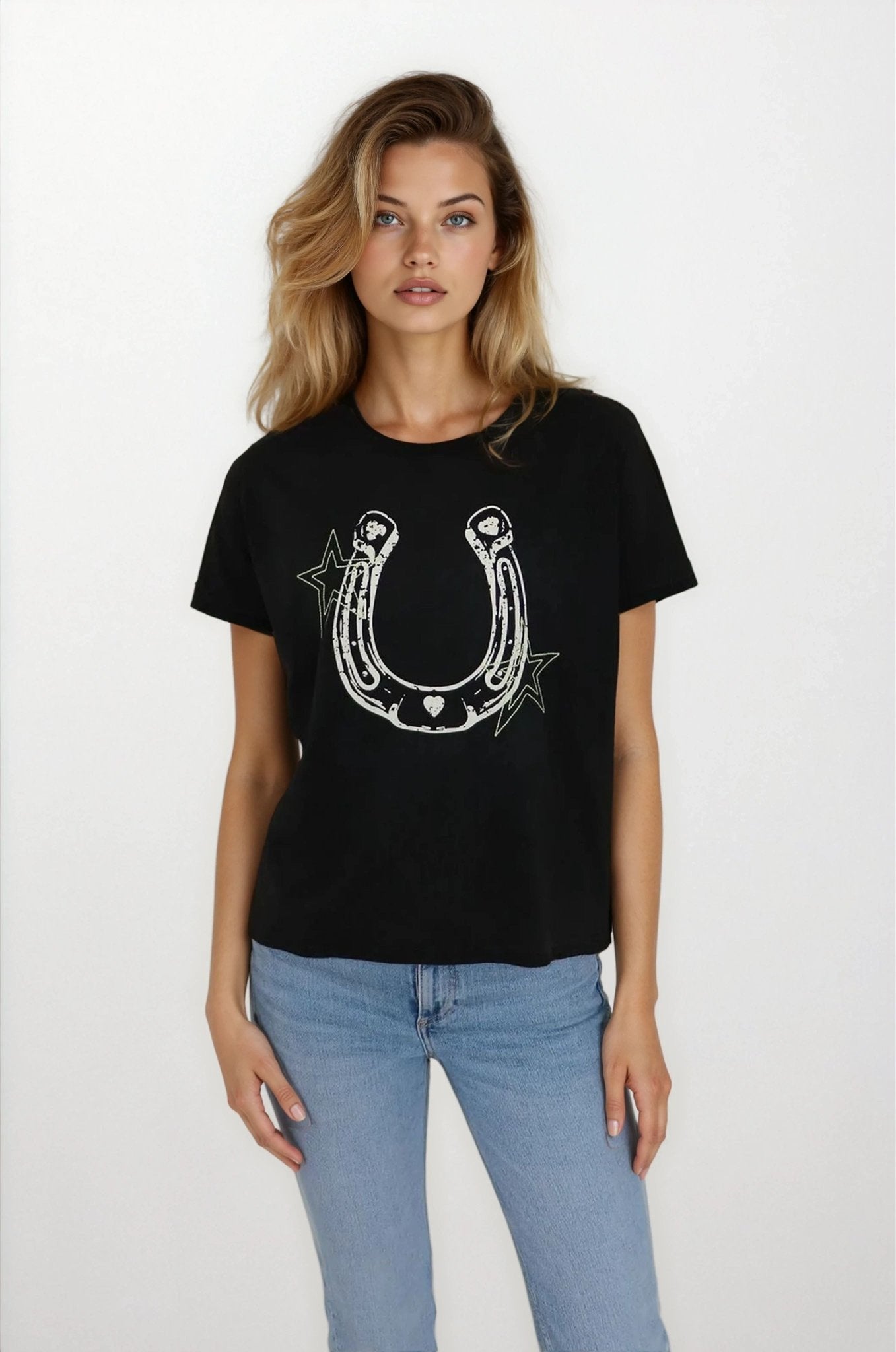 Woman wearing a black t-shirt with a horseshoe design on a white background
