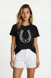 Woman wearing a black t-shirt with a horseshoe design on a white background