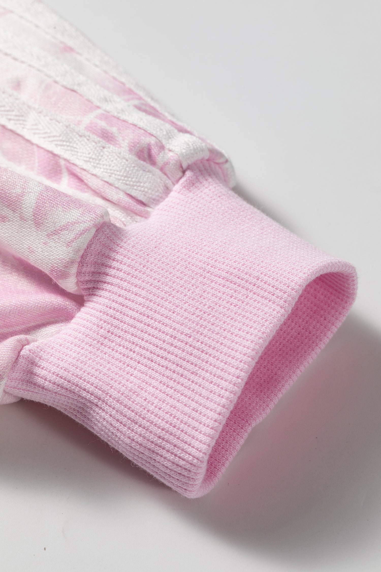Pink sweatshirt ribbed cuff and white sleeve stripe detail