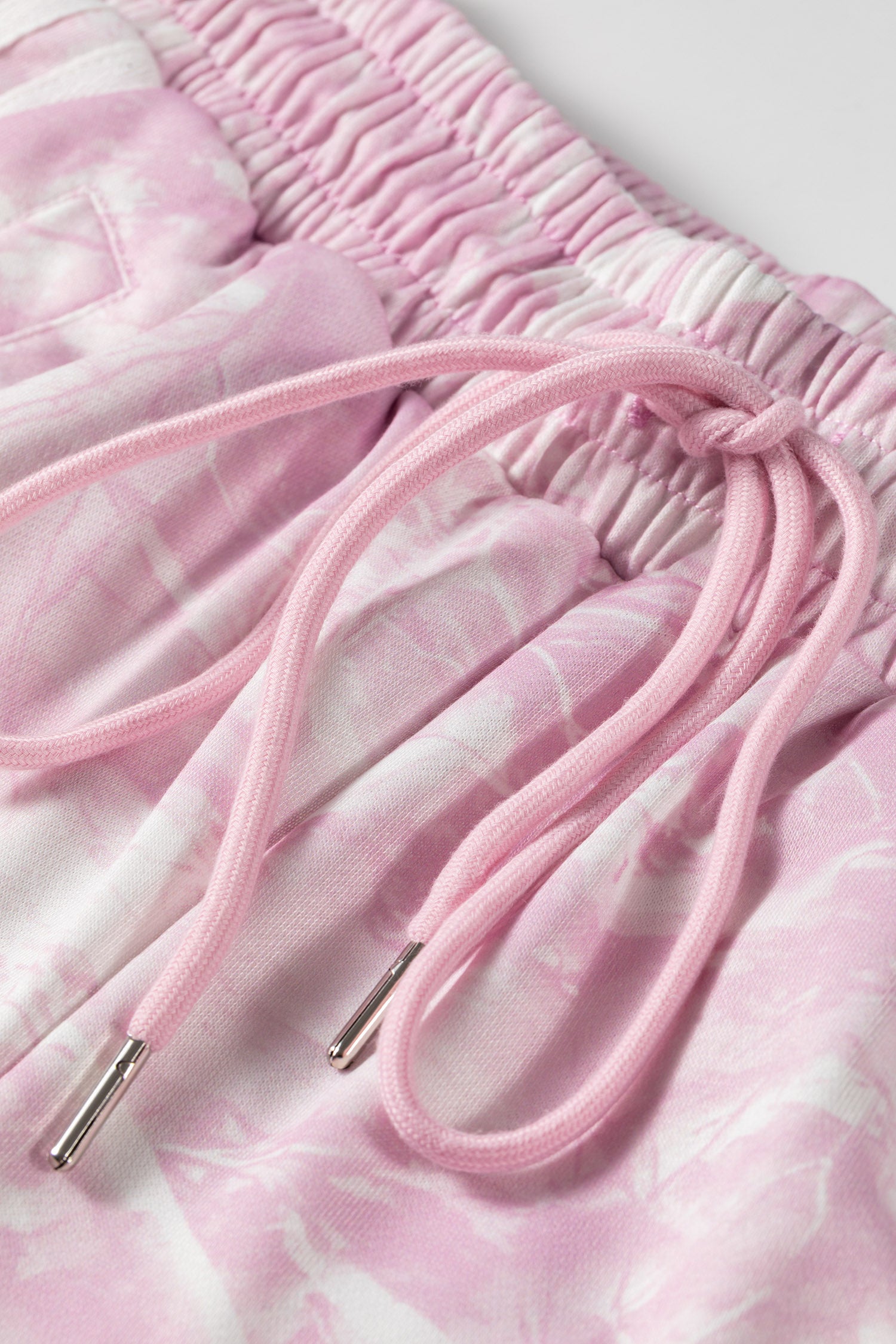Pink pants drawstring with metal tips close-up