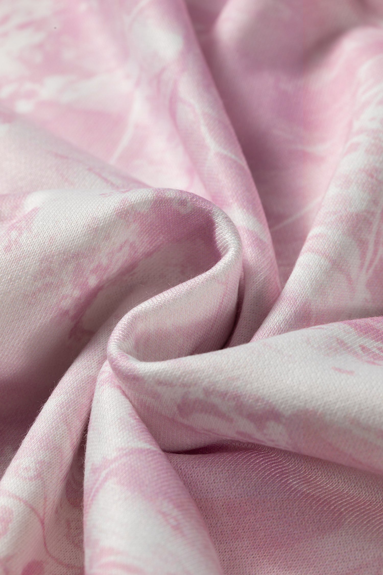 Close-up of soft pink and white abstract print fabric