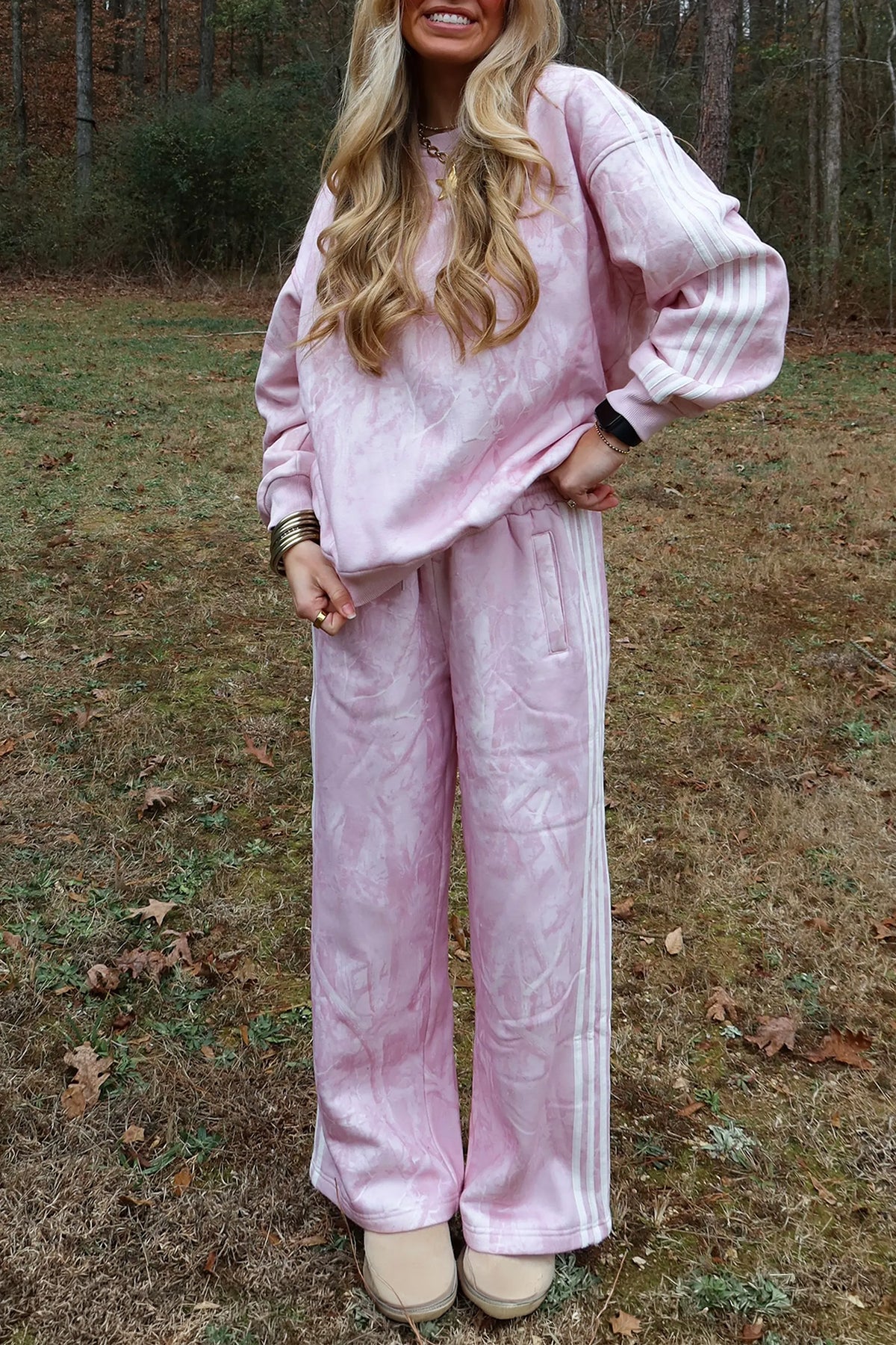 Women's pink abstract print sweatshirt and side stripe wide leg pants set, front view