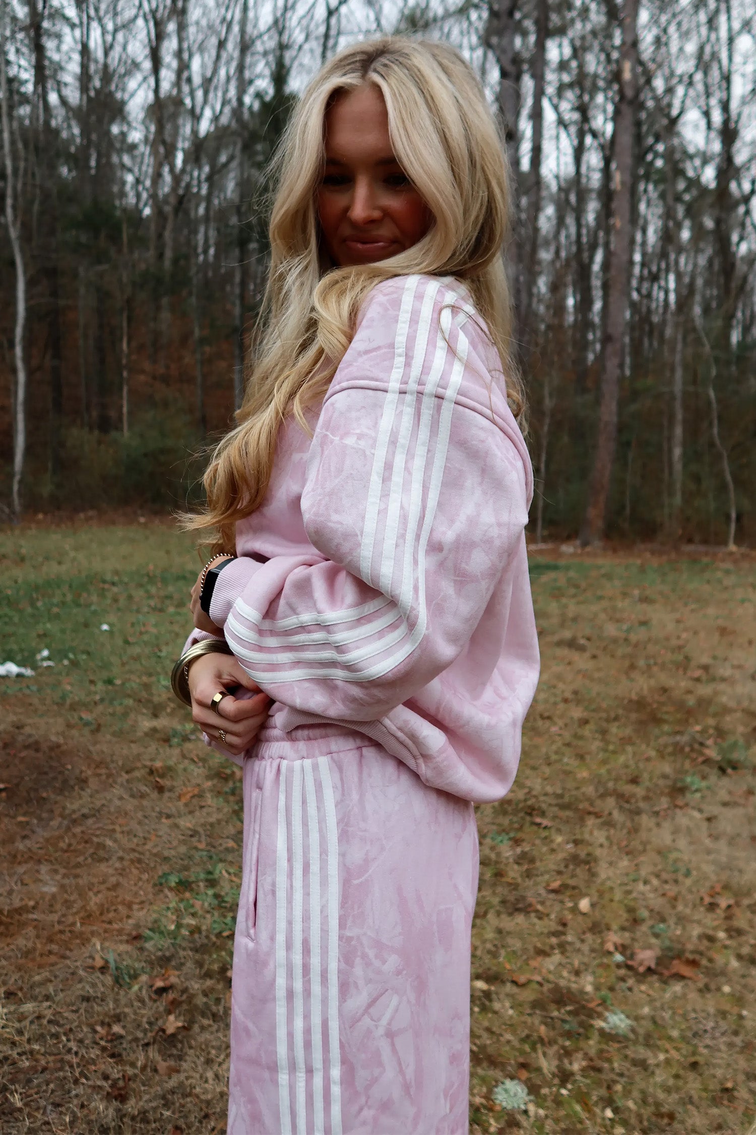 Pink abstract print set with white sleeve and leg stripes, side view
