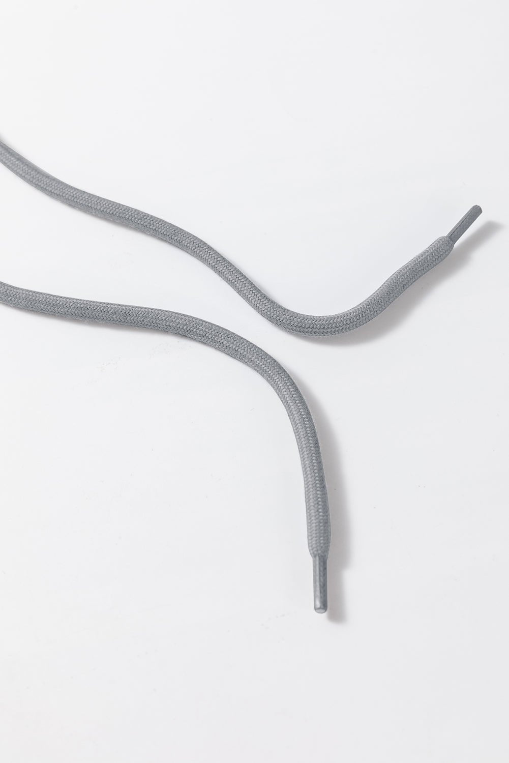 Gray shoelaces on a white background
