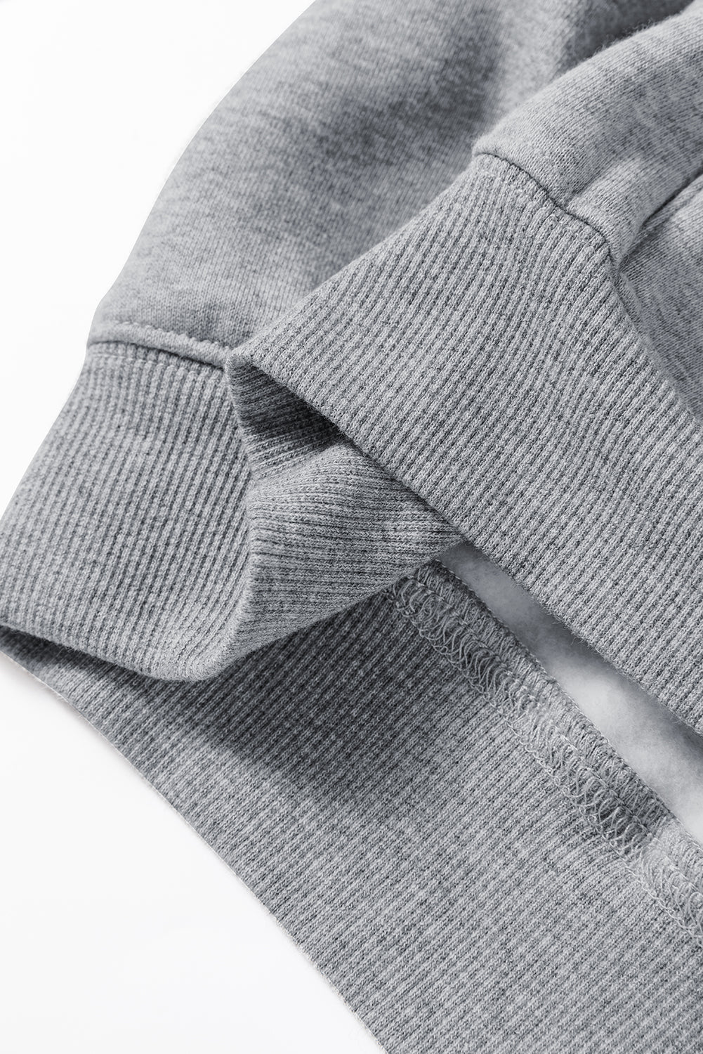 Close-up of a gray textured fabric with a white background