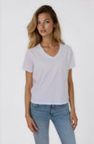 Woman wearing a plain white t-shirt and light blue jeans on a white background