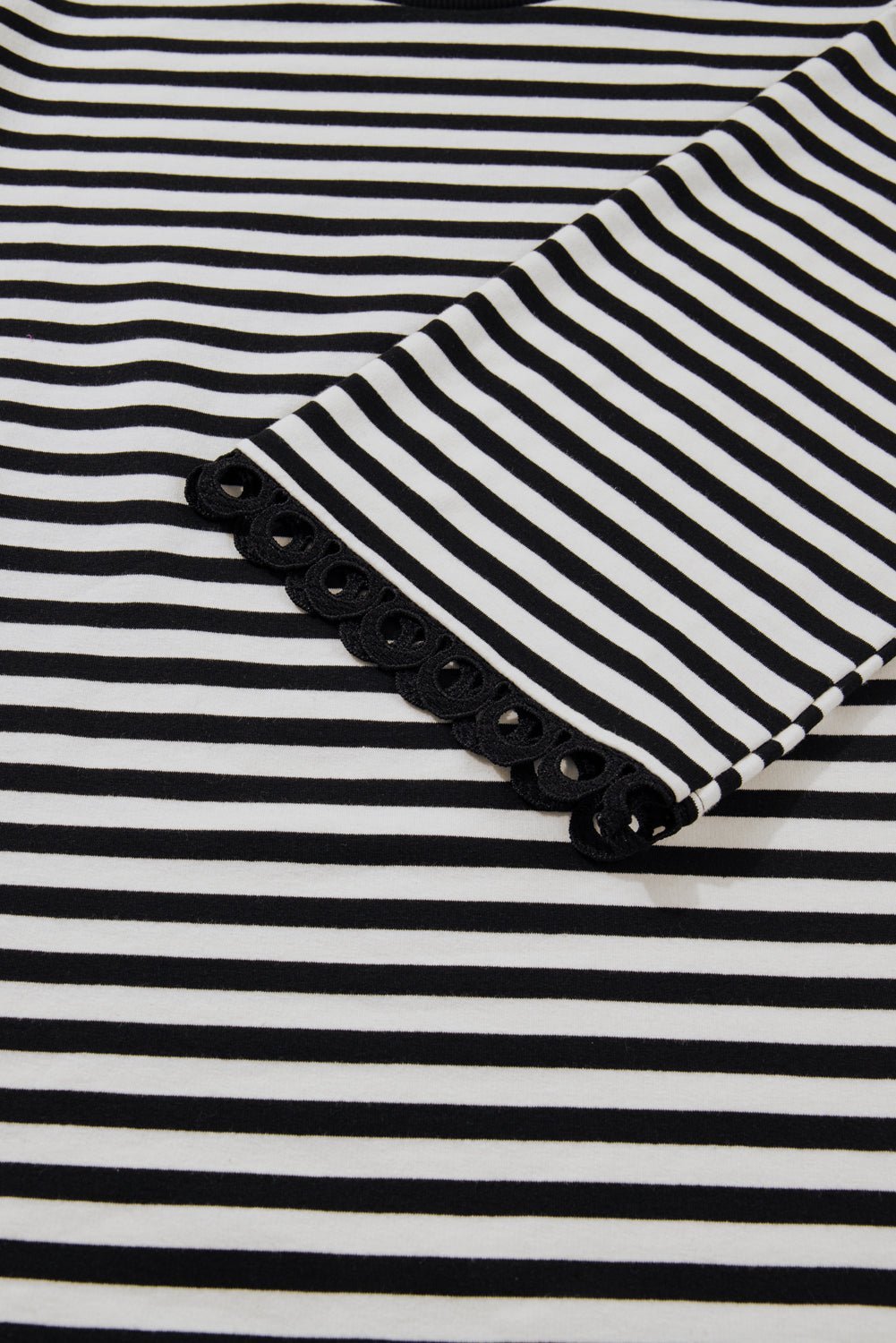 Black and white striped fabric with a pocket detail