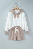 Khaki striped half zip top and drawstring shorts set on a hanger, front view