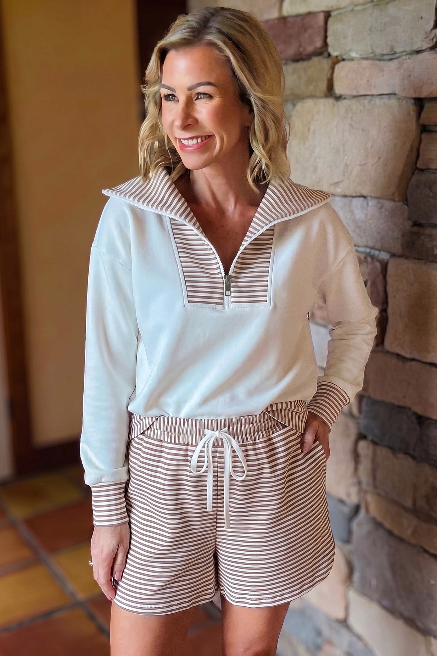 White half zip top with striped fold-over collar and striped shorts, styled front view