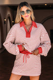 Woman wearing a red and white striped dress with a collar in an indoor setting.