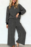 Women's black and cream striped pullover and wide leg pants set, front view