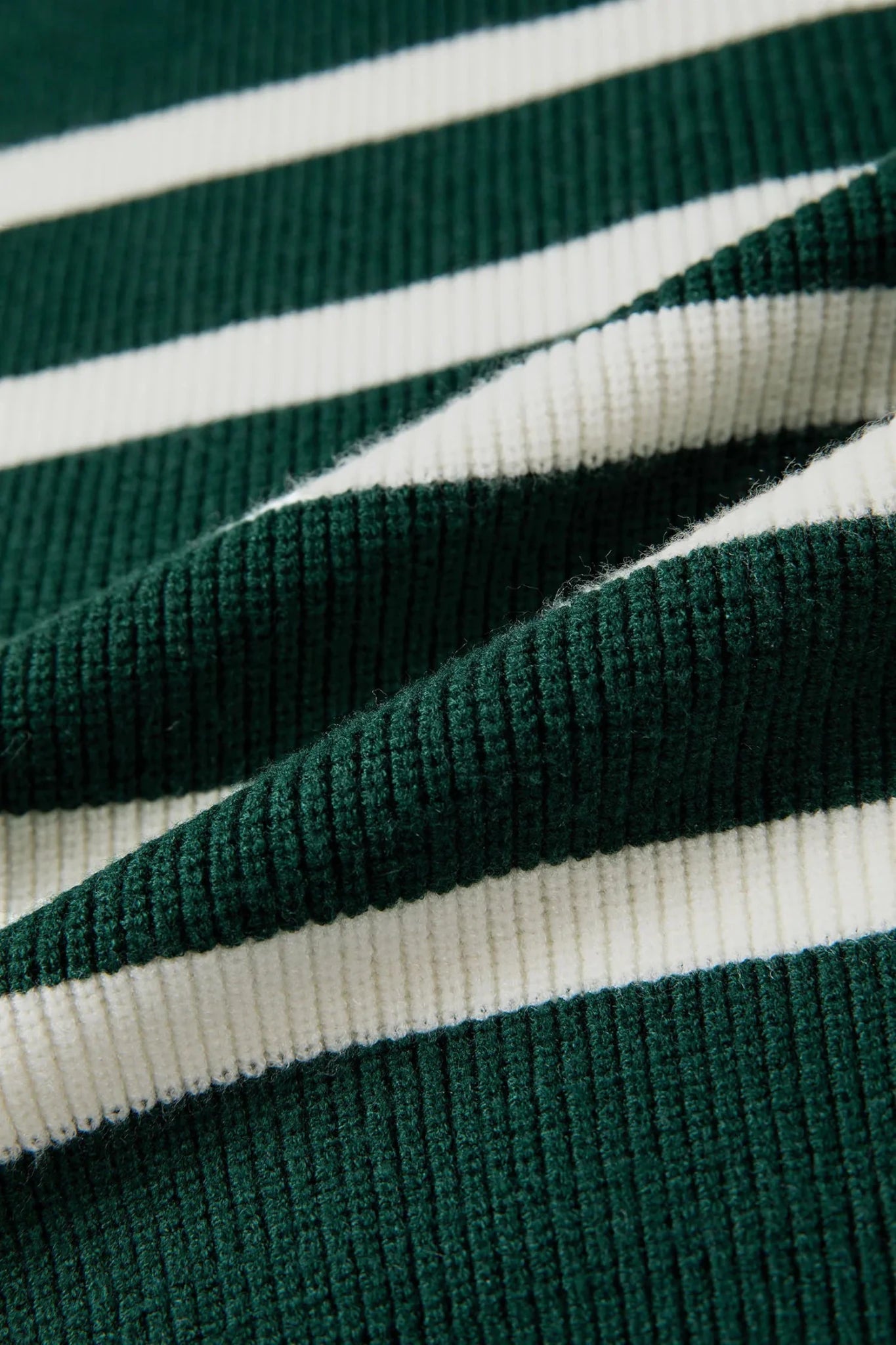 Close-up of green and white striped fabric texture
