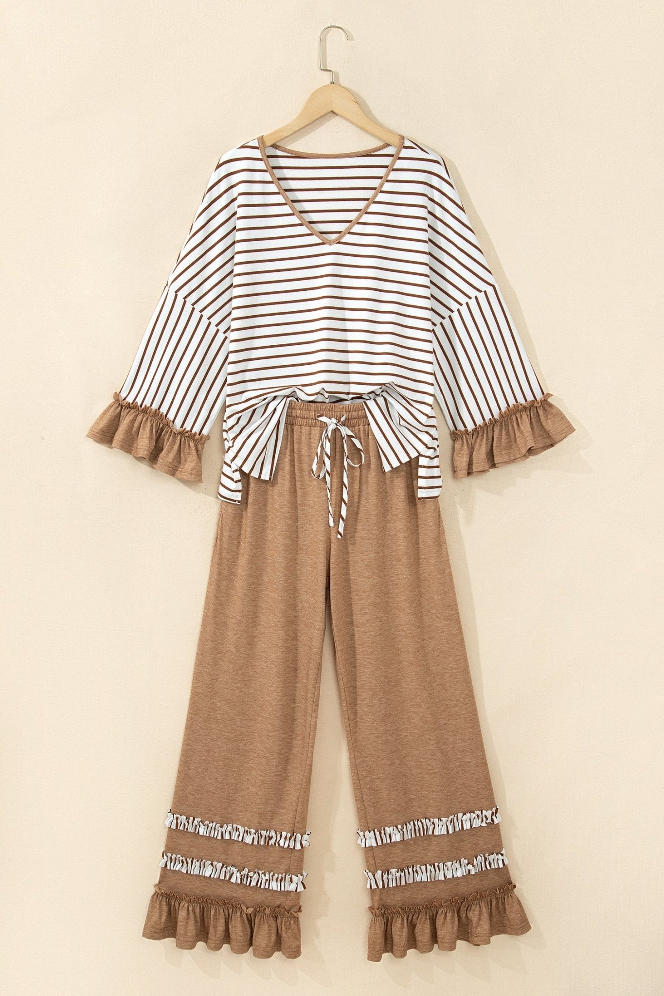 Brown and white striped two-piece set with ruffled waist tie and wide-leg pants.

