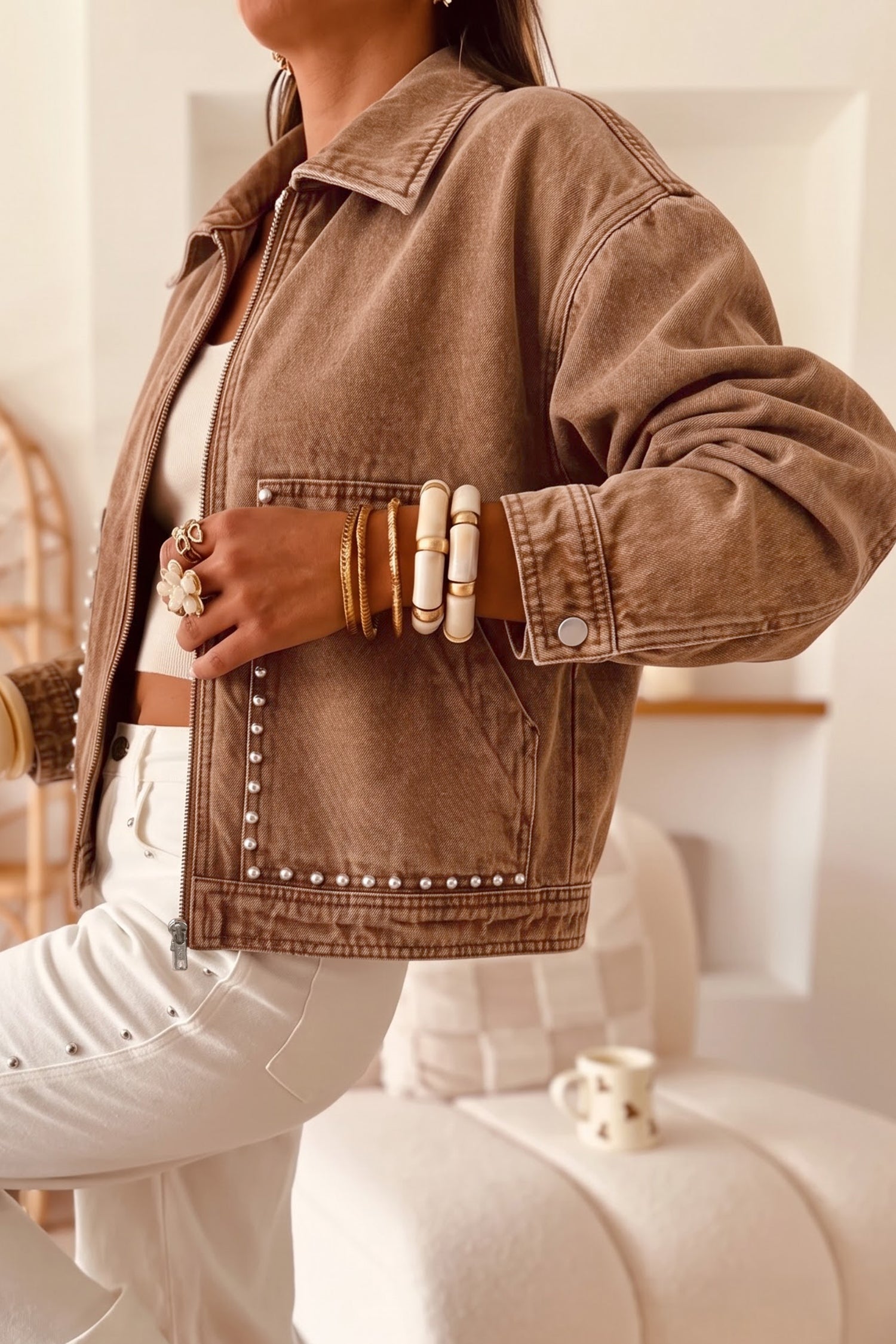 Coffee denim jacket with silver studded pockets and hem, styled view