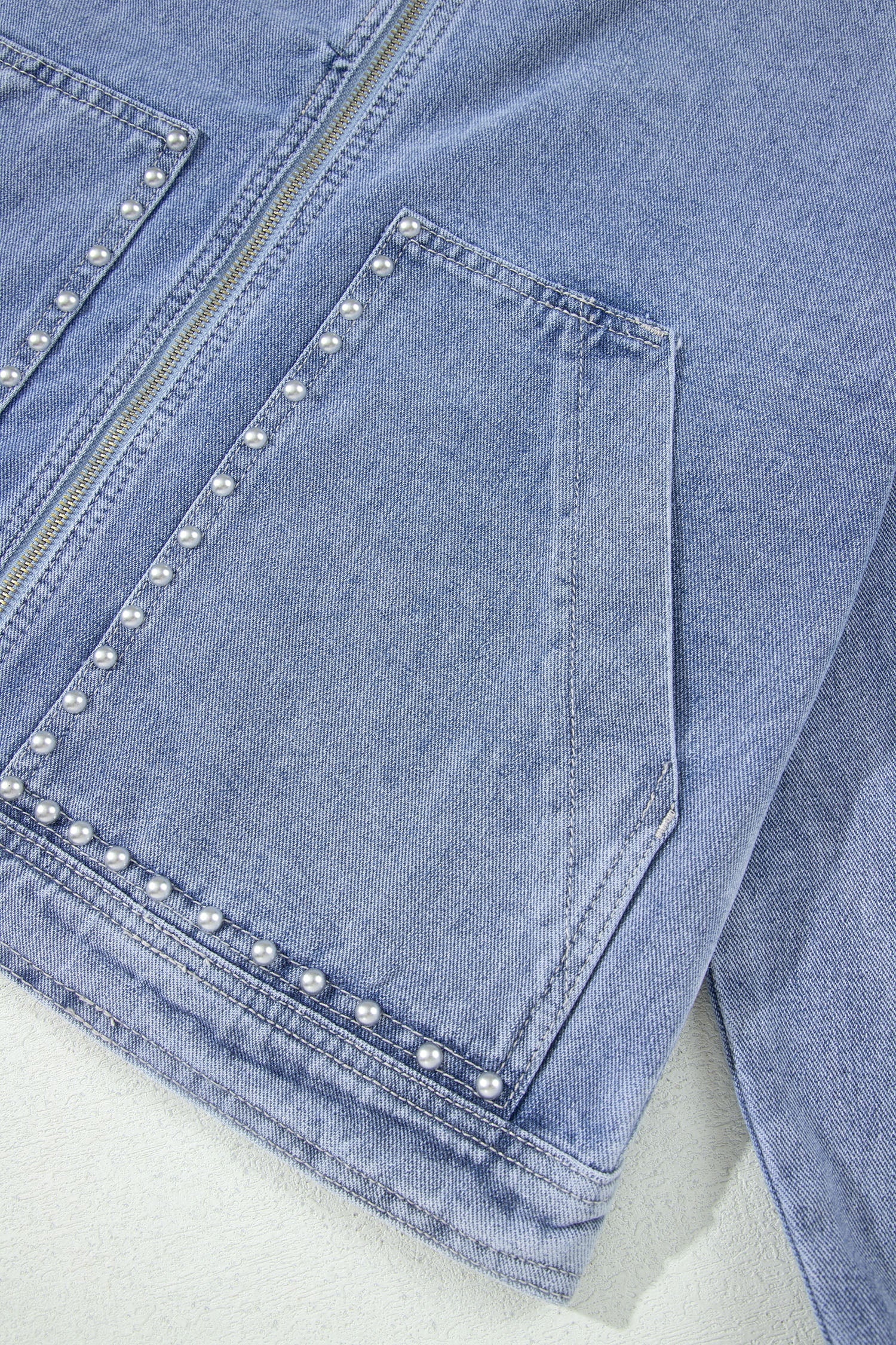 Light blue denim jacket silver studded pocket and hem detail